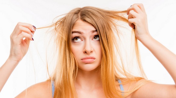 Sad girl looking at her damaged hair; Shutterstock ID 364442840; PO: today.com